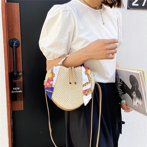 Handmade heart-shaped straw bag with silk scarf handle and leather shoulder strap for summer