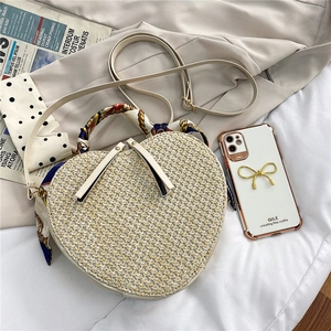 Chic heart-shaped straw woven crossbody bag with colorful silk scarf handle and strap