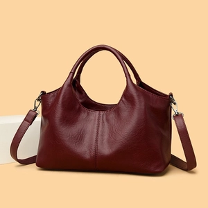 Deep burgundy large capacity leather handbag with dual handles and shoulder strap