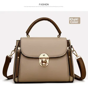 Detail of khaki pebbled leather handbag with gold buckle closure and side zipper