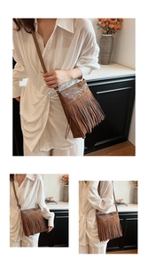 Detailed embroidery and fringe on a bohemian brown suede crossbody bag for women