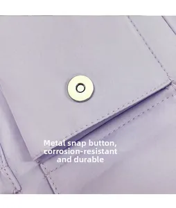 Detail of lavender canvas bag featuring a durable silver magnetic snap closure