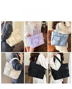 Detail of large nylon tote bag featuring front flap pockets in four pastel color options