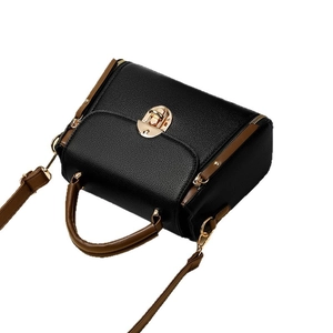 Classic Boston handbag in black lychee texture with brown leather straps and gold lock closure