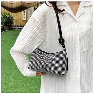 Detail showing the shiny silver rhinestone mesh surface of the trendy shoulder bag