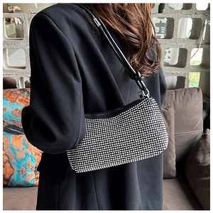 Chic rhinestone shoulder bag with leather strap shown in a lifestyle setting