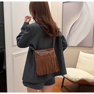 Brown suede crossbody bag with ethnic silver feather embroidery and long fringes