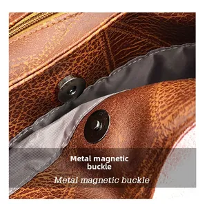 Macro detail showing vintage dark brown leather grain with silver metal magnetic buckles