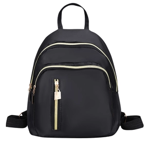 Sac à dos classique noir en nylon pour femme avec fermetures éclair dorées et sangles