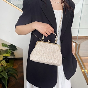 Retro straw shell clutch with gold metal handle and chain strap for stylish women