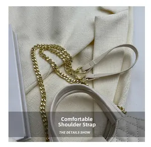 Close-up of stylish quilted chain strap and beige leather texture on fashion mini bag