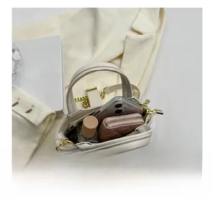 Top view of beige quilted mini bag showing interior space for phone and wallet