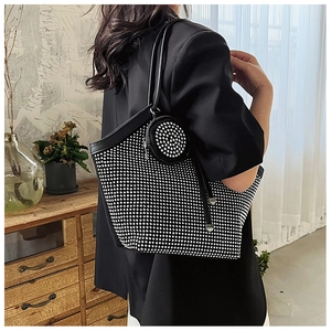Detail of black tote bag with silver rhinestones and mini round coin purse attached