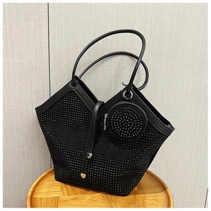 Detailed close-up of a large black rhinestone tote bag with a matching small round coin purse