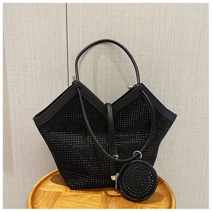Detail of black rhinestone tote bag with a V-cut structure and round coin purse accessory