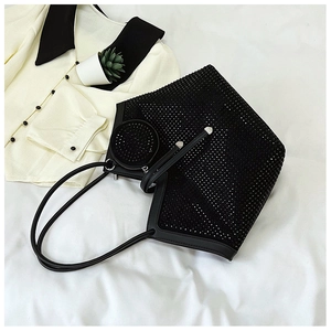 Close-up of black rhinestone tote bag with a matching small round coin purse detail