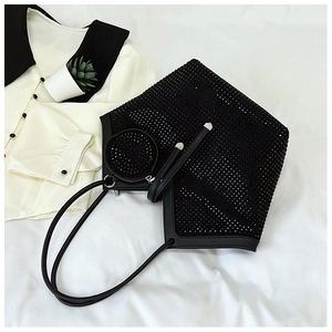 Close-up of black rhinestone tote bag showing sparkling geometric texture and round pouch