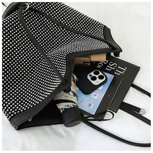 Interior view showing the large capacity of this rhinestone tote bag with daily items