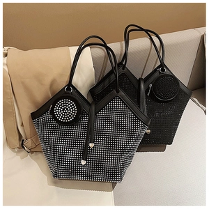 Detail view of large tote bags with decorative rhinestones and matching round coin pouches