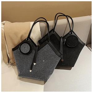 Close-up of silver and black rhinestone tote bags with matching round coin purses