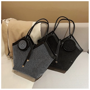Detailed close-up of rhinestone tote bag featuring a matching round coin purse