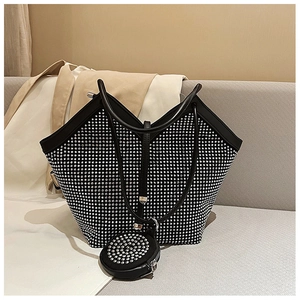 Close-up of black rhinestone tote bag with sparkling silver crystals and small round coin purse