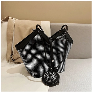 Detail of black rhinestone tote bag with matching round coin purse charm