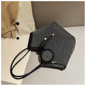 Detailed close-up of a black tote bag with shimmering rhinestones and a small coin purse