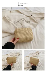 Detail of khaki straw weave handbag with silver chain strap and cloud texture design