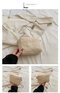 Detailed view of beige woven straw shoulder bag with elegant silver metal chain strap
