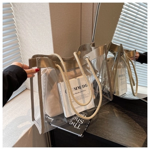 Detail of transparent PVC tote bag with khaki canvas inner pouch and rope handles