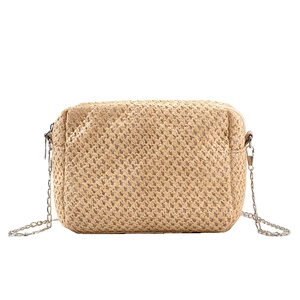 Summer straw crossbody bag with metal chain strap and woven texture on white background