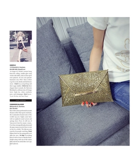 Detailed view of shimmering gold sequin envelope clutch bag with elegant metallic bar closure