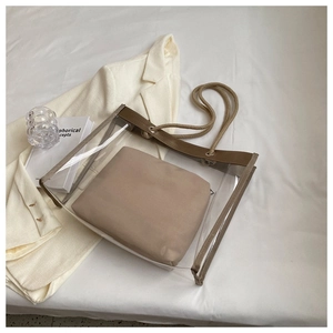 Top view of transparent PVC tote bag with beige inner pouch and braided rope handles