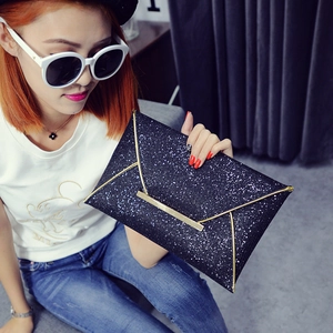 Elegant black sequin envelope clutch bag with gold metal trim for parties and evening events