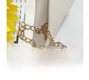 Close-up of elegant gold metal chain strap for high-end party clutch and evening bags