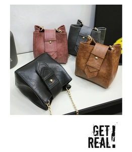 Detail view of four textured PU leather bucket bags in black, red, gray and camel colors