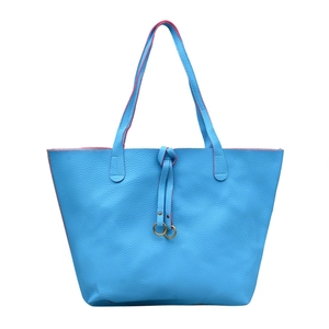 Sky blue lychee leather tote bag with pink trim and decorative golden metal rings