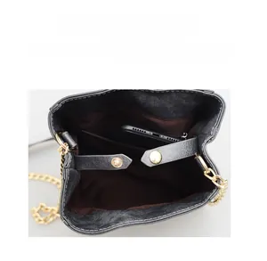 Internal view of fashion crossbody phone bag with chain strap and magnetic closure
