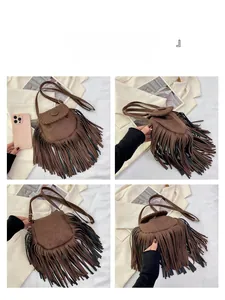 Detailed views of a brown faux suede saddle bag with fringe tassels and a phone for scale
