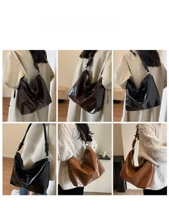 Hobo bag detail showing woven knot strap and glossy finish in multiple colors