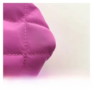 Detail shot of purple quilted tote bag with diamond stitching and high-quality nylon texture