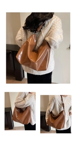 Detail view of caramel brown glossy tote bag with stylish metallic rings and texture