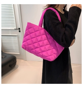 Hot pink quilted tote bag showing large capacity design and padded nylon shoulder straps