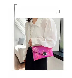 Pink holographic crocodile pattern envelope bag with gold chain strap and geometric buckle