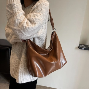 Chic large capacity faux leather hobo bag in caramel brown with decorative knot strap