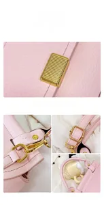 Close-up of pink lychee pattern leather handbag with gold metal lock and hardware details