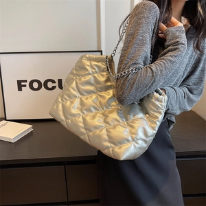 Large silver quilted chain shoulder bag for women with metallic texture and tote style
