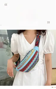 Close-up of ethnic waist bag with colorful woven texture and light blue leather detail