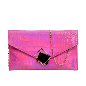 Hot pink envelope clutch bag with crocodile texture and metallic gold chain strap